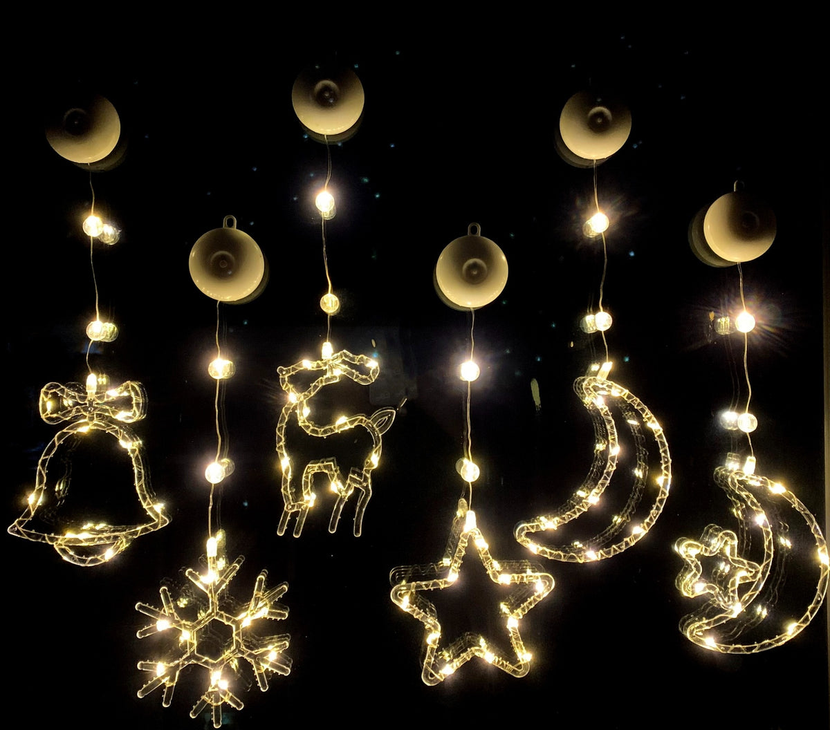 Christmas window hanging LED lights black background illuminated effect