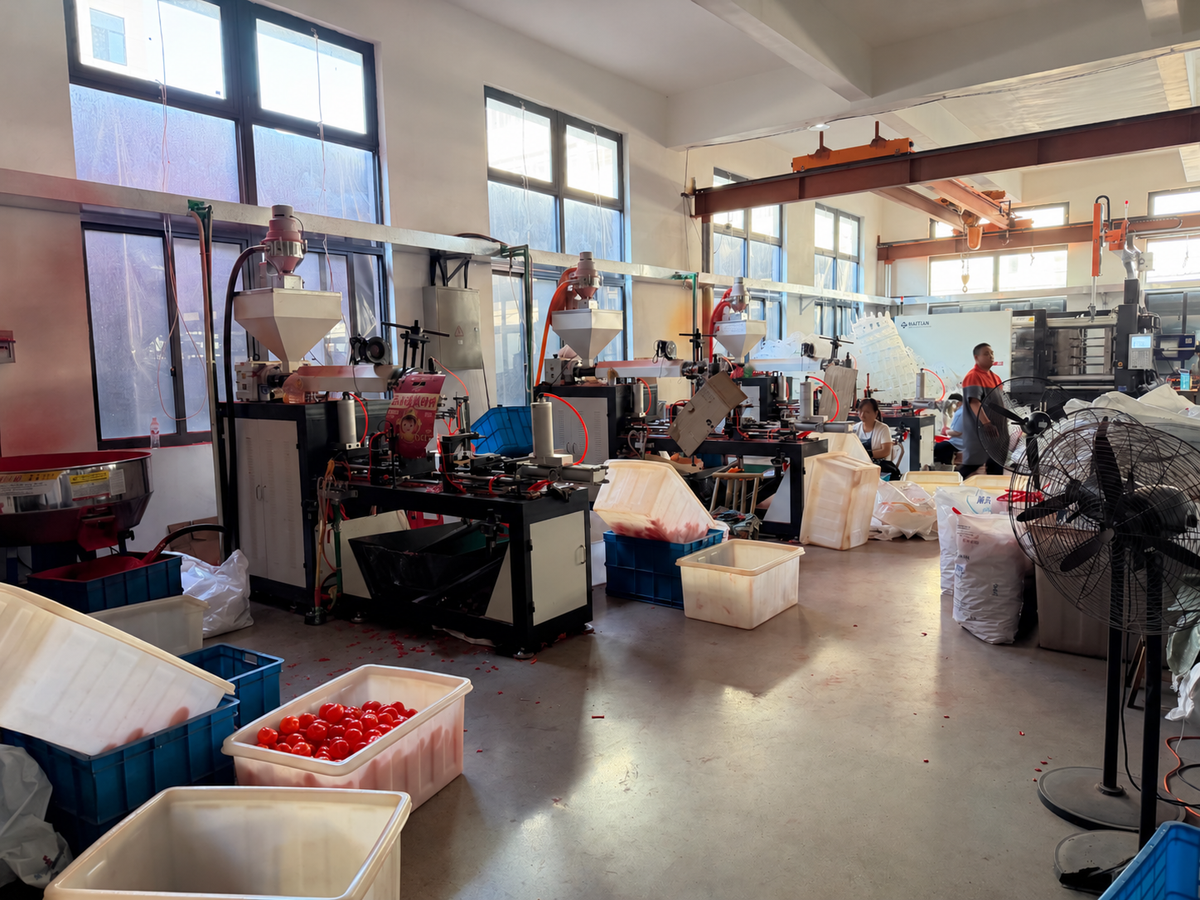 Injection molding machines and work area in a lighting factory