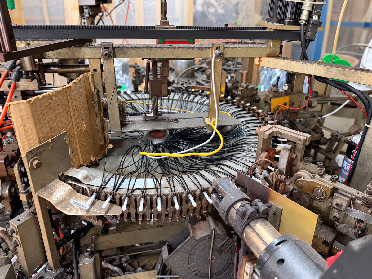 Edited crop of the real hot-lamp production machine in the workshop